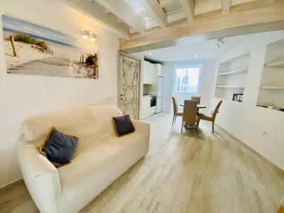 a living room with a couch and a table at Luz, aire y mar Grupo AC Gestion in Cádiz