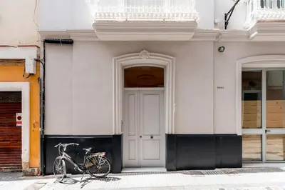 a bike parked in front of a building at Genteel Home Sagasta in Cádiz