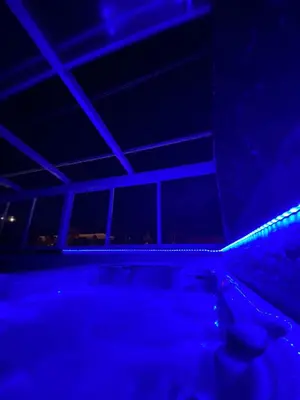 a dark room with blue lights on the ceiling at Cabildo Spa 1 in Sanlúcar de Barrameda