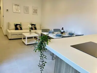 a living room with a dog sitting on a couch at GATU PREMIUM Alma marinera, Preferente mayores de 21 años y familias in Cádiz