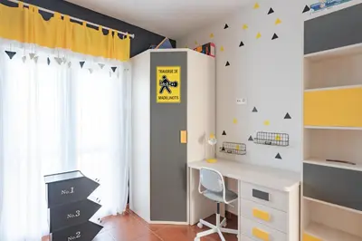 a childs room with a desk and a window at Costa Ballena Unifamiliar in Costa Ballena