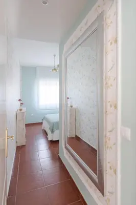 a room with a mirror on the wall at Costa Ballena Unifamiliar in Costa Ballena