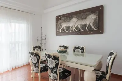 a dining room with a table and chairs at Costa Ballena Unifamiliar in Costa Ballena