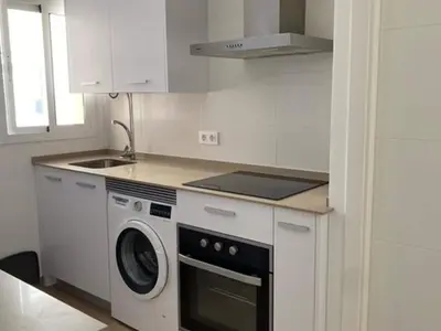 a kitchen with a washing machine and a sink at Beautiful apartment in San Fernando near lake in San Fernando