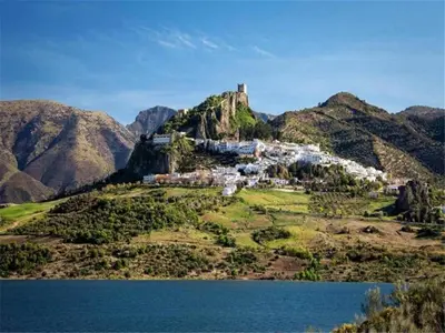 a castle on top of a hill next to a body of water at Beautiful apartment in San Fernando near lake in San Fernando