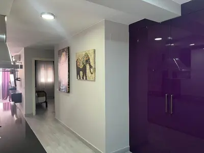 a bathroom with purple walls and a purple cabinet at Piso Centro La Morena, Climatizado, Wifi in Sanlúcar de Barrameda