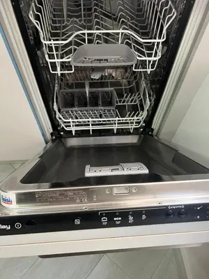 a dish washer with two controllers inside of it at Piso Centro La Morena, Climatizado, Wifi in Sanlúcar de Barrameda