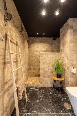 a bathroom with a shower with a ladder and a table at La Casa de los Arcos - Casco Histórico - Parking opcional in Jerez de la Frontera