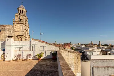 a view of a building with a clock tower at La Casa de los Arcos - Casco Histórico - Parking opcional in Jerez de la Frontera