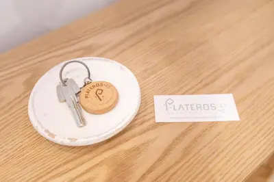 a pair of keys sitting on top of a table at Plateros 48 Apartamento in Sanlúcar de Barrameda