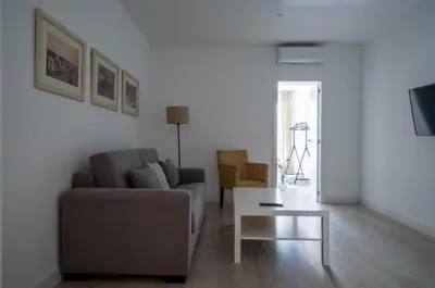 a living room with a couch and a coffee table at El Mirador de El Puerto in El Puerto de Santa María