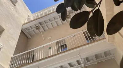 a building with white balconies on the side of it at El Mirador de El Puerto in El Puerto de Santa María