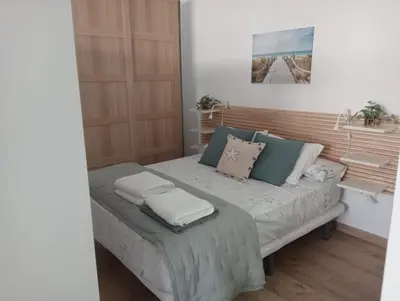 a bedroom with a bed with two pillows on it at Apartamento Mar I in San Fernando