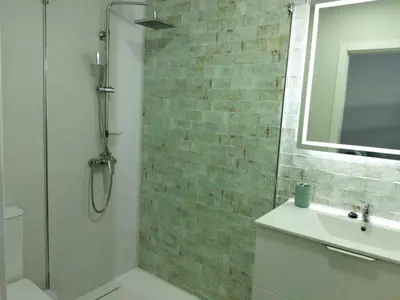 a bathroom with a shower and a sink and a mirror at Apartamento Mar I in San Fernando