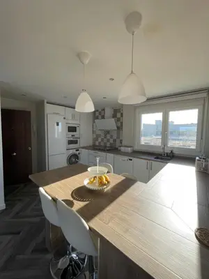 a kitchen with a table with bananas on it at Piso playa Maktub in Puerto Real
