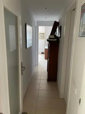a hallway with a tile floor in a house at Quito in El Puerto de Santa María