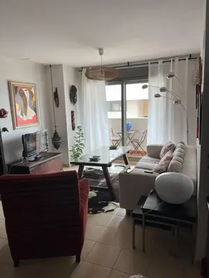 a living room with a couch and a table at Quito in El Puerto de Santa María
