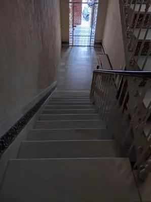 a stairway leading up to a building with a window at Casa Hormaza in Chiclana de la Frontera