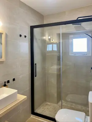 a bathroom with a shower with a toilet and a sink at CasaElbarranko in Arcos de la Frontera
