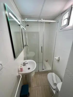 a bathroom with a shower and a sink and a toilet at La Roca del Sur by Cadiz Time in Cádiz