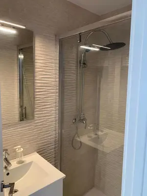 a bathroom with a shower and a sink at Casa Amapola - Costa Bahía de Cádiz in Puerto Real