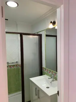 a bathroom with a sink and a shower at Casa Amapola - Costa Bahía de Cádiz in Puerto Real