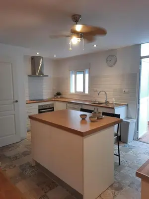 a kitchen with a large island in the middle at Casa Amapola - Costa Bahía de Cádiz in Puerto Real