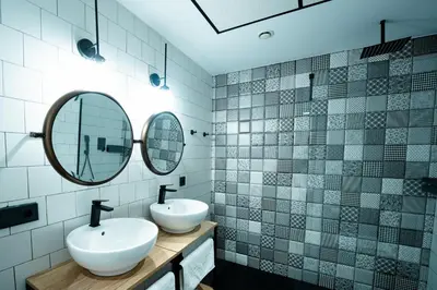 a kitchen and living room with a sink and a couch at Aparthotel Luz de Gades - Suites Spa Gym - Adults Only in Cádiz