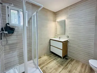 a bathroom with a sink and a shower at La Casita del Mar in El Puerto de Santa María