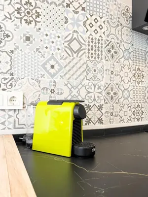 a yellow toaster sitting on a table in a kitchen at Apartamento Mucha Vida Little Apartments in Cádiz