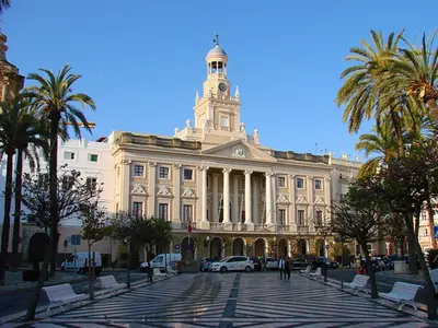 a large building with a clock tower on top of it at Apartamento Mucha Vida Little Apartments in Cádiz