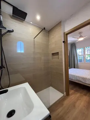 a bathroom with a sink and a mirror at Playa Sancti Petri in Chiclana de la Frontera