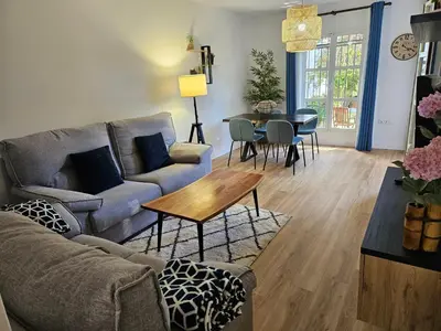 a living room with a couch and a table at Playa Sancti Petri in Chiclana de la Frontera