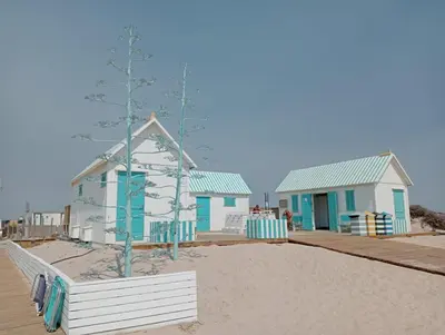 a row of beach houses on the beach at Apartamento Mar II in San Fernando