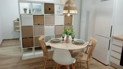 a kitchen and dining room with a table and chairs at Apartamento Mar II in San Fernando