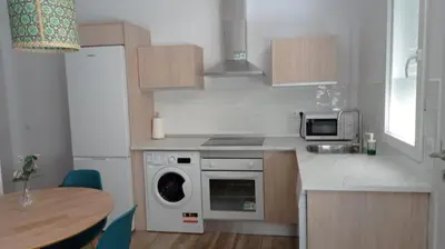 a kitchen with a stove top oven next to a microwave at Apartamento Mar II in San Fernando