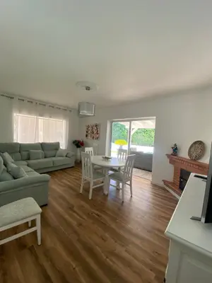 a living room with a couch and a table at Chalet Brisas del Mar in Chiclana de la Frontera