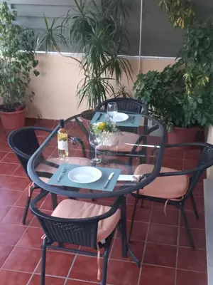 a garage with two doors and a car parked in it at EL ATICO DE MARIA con garaje, piscina y terraza in El Puerto de Santa María