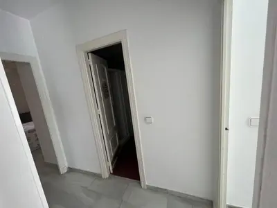 an empty hallway with an open door in a room at CASA RAUSER in Chipiona