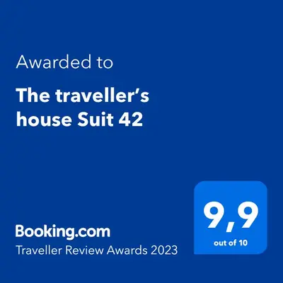 a blue sign that reads awarded to the travellers house suite at Suit 42 Playa y Ascensor Grupo AC Gestion in Cádiz