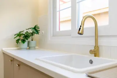 a white sink in a kitchen with a window at Sherryflat Alma in Jerez de la Frontera