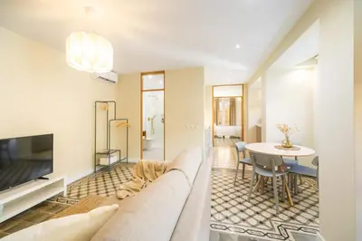 a living room with a couch and a table at Sherryflat Alma in Jerez de la Frontera