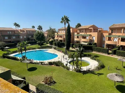 an overhead view of a swimming pool in a resort at Ático Amaranta in Chiclana de la Frontera