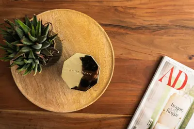a wooden plate with a piece of soap and a plant at Prim 14 by 7Escalones in Rota