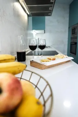 two glasses of red wine sitting on a kitchen counter at Prim 14 by 7Escalones in Rota