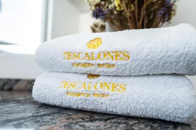 a stack of towels sitting on a table at Prim 14 by 7Escalones in Rota