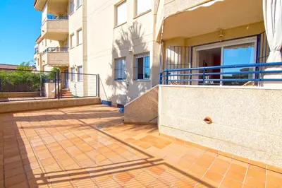 a balcony of a apartment building with a ramp at Aires de Bajo de Guía, Apartamentos Living Sur in Sanlúcar de Barrameda