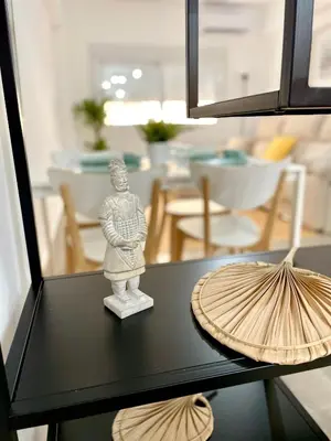 a table with a statue on top of it at Carmen viejo 12 in Sanlúcar de Barrameda