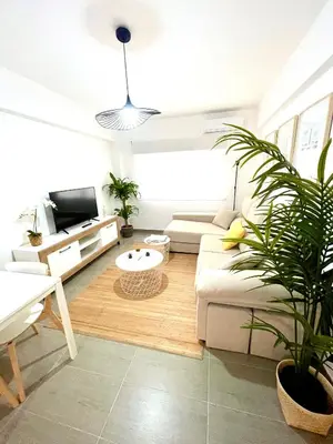 a living room with a couch and a table at Carmen viejo 12 in Sanlúcar de Barrameda