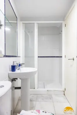 a white bathroom with a shower and a sink at Loft Santa María by Cadiz Time in Cádiz